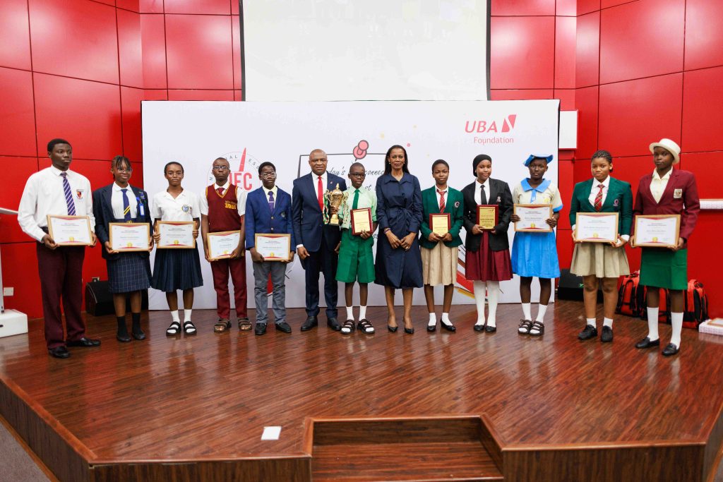 Group Managing Director/CEO, United Bank for Africa (UBA), Mr. Oliver Alawuba; 1st Runner up, 2025 UBA Foundation National Essay Competition and Student of Christian International High School, Owerri, Emerald Njokwu Kelechi; Winner, and student of Igando Community Senior High School, Igando, Lagos, Ebunoluwa Seth Oluwatimelehin;  2nd Runner up, and student of Cornerstone Montessori Schools, Gudu Abuja, Bayero Fatima Auwal; and Managing Director, UBA Foundation, Mrs Bola Atta, flanked by finalists of the 2025 UBA Foundation Essay Competition for Senior School Students in Nigeria, during the grand finale of the competition held at UBA House, Lagos, on Tuesday.