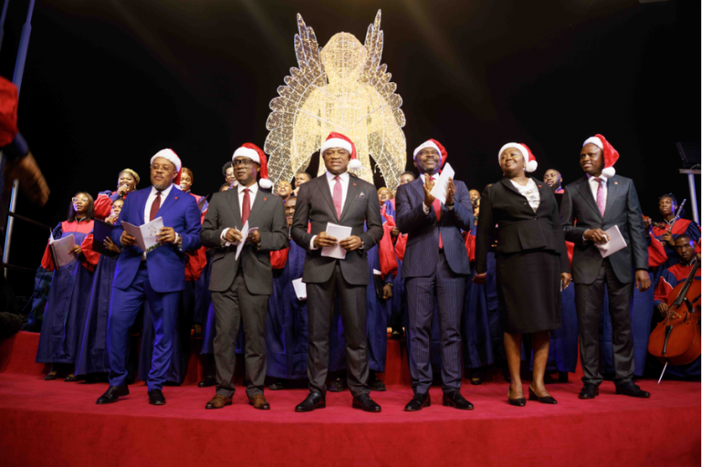 l-r Executive Director, Alex Alozie; Deputy Managing Director, Chukwuma Nweke; Group Managing Director/CEO, Oliver Alawuba; Deputy Managing Director, Muyiwa Akinyemi; Executive Directors – Abiola Bawuah and Ugo Nwaghodoh, flanked by Lagos Community Gospel Choir, at the UBA Christmas Light Up and Carol Evening, held at the UBA House and UBA Foundation Roundabout in Marina, Lagos on Monday