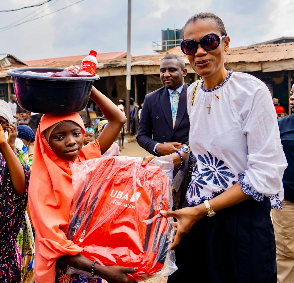 MD/CEO UBA Foundation, Bola Atta presenting gifts items to children of  vulnerable communities at Okobaba, Lagos, recently