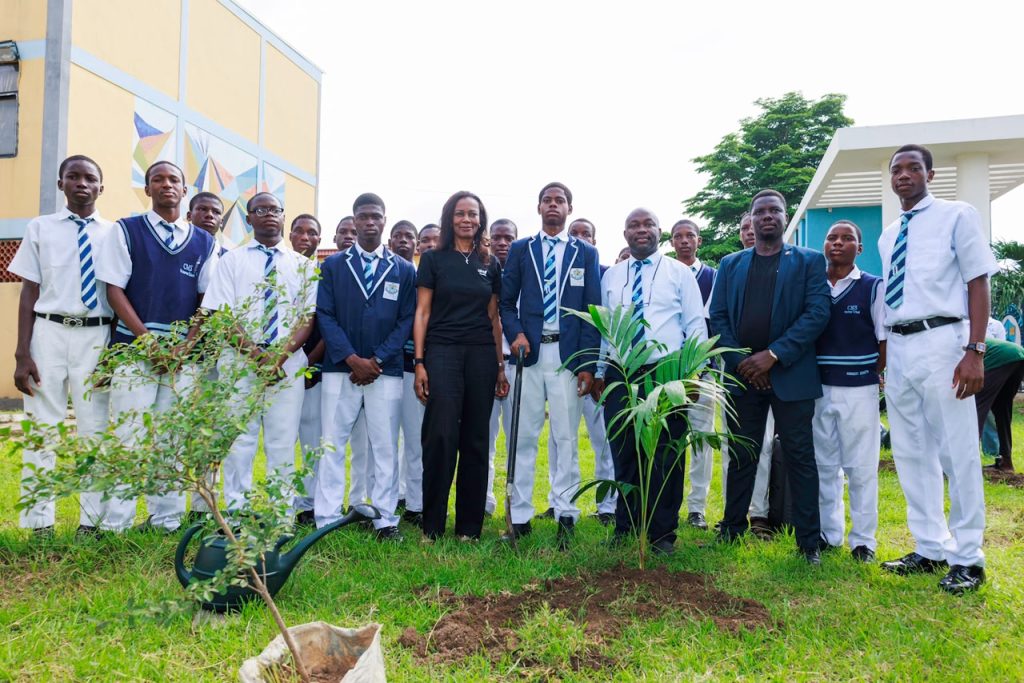 L - R: Managing Director/CEO, UBA Foundation, Bola Atta; Principal, CMS Grammar School, Jacob Ayokunle Ogunyinka, and Health, Safety and Environment (HSE) Manager, United  Bank for Africa (UBA), Khalid Agboola; flanked by students of CMS Grammar School, Bariga, during the UBA Foundation Tree Planting Exercise held at the school, in commemoration of World Environment Day 2026, on Friday