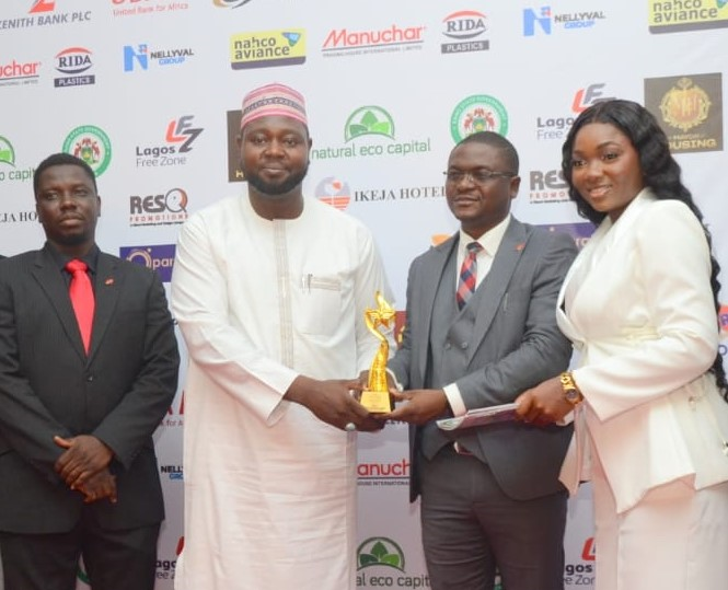 L–R: Health, Safety and Environment (HSE) Manager, United Bank for Africa (UBA), Khalid Agboola; Special Adviser to the Governor of Kano State, Alhaji Tijani S.S.; Head, Audit Transformation, Business Process and Policy Governance, UBA, Olayemi Alawode; and broadcaster, Happiness Owonte, during the presentation of the Best Financial Services Company award to UBA at the 2026 National Sustainability Achievements Awards in Lagos, recently