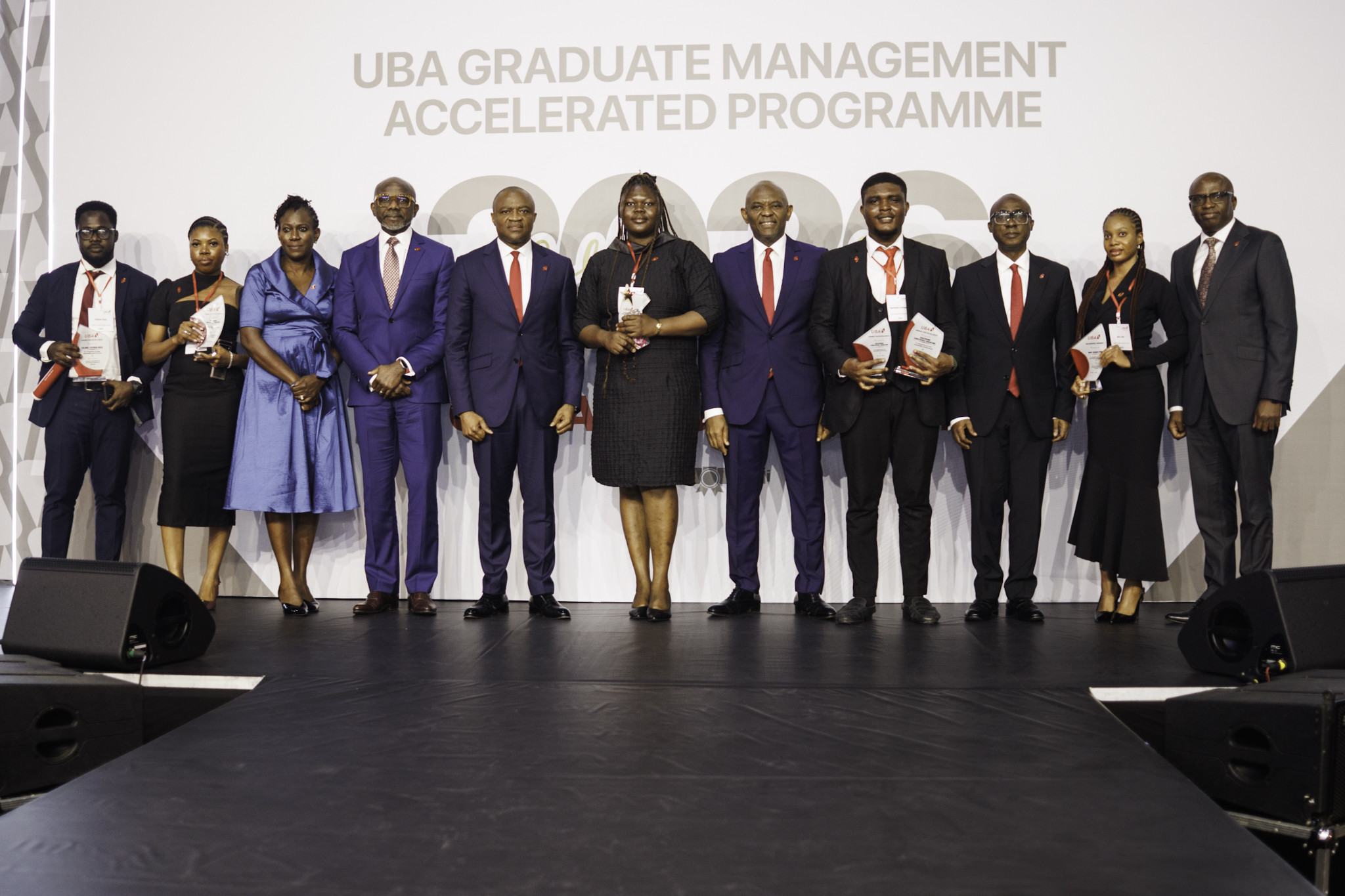 Group Chairman, United Bank for Africa, Tony Elumelu (7th left); Group Managing Director, UBA, Oliver Alawuba, (5th Left); Group Head, Human Resources, Modupe Akindele (3rd left) and Executive Director, Finance, Ugo Nwaghodoh , flanked by best the graduands of the 2026 Graduate Management Accelerated Programme(GMAP) class of UBA Academy, during the graduation ceremony held for over 374 trainees from across Africa, in Lagos on Thursday.